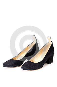 Women`s black shoes with heels on a white background