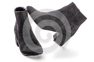 Women`s boots with high heels on a white background