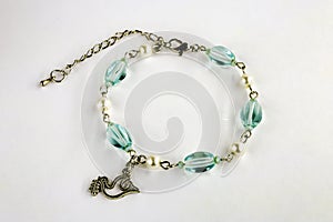 Women`s bracelet with charm with with the image of a dove