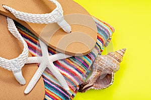 Women`s Causal natural color Beach Flip Flops and Colorful Striped Beach Towel decorated with White Finger Starfish and Seashells