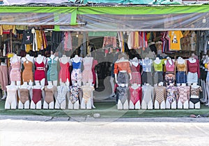 Women`s clothing on mannequins in the store