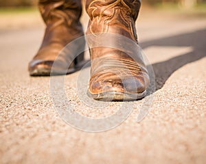 Toe of a Cowboy Boot, Walking Forward