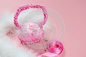 Women`s creativity, hobby. Decorative basket of satin ribbons, made by hand. Copy space