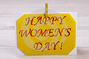 Women`s Day card with clothespin.