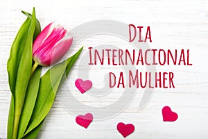 Women`s day card with Portuguese words `dia internacional da mulher`. photo