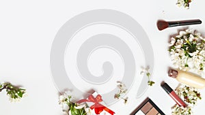 women's day, Valentine's Day, happy birthday day. Various decorative cosmetics, spring flowers on white background