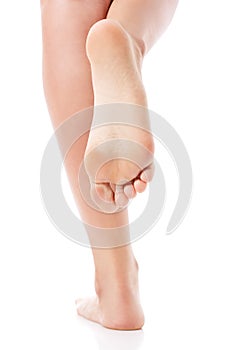 Women's feet on white background.