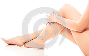 Women`s feet on white background.