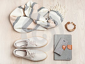 Women`s flat lay clothes shoes, scarf, bracelet, bag, tablet, sm