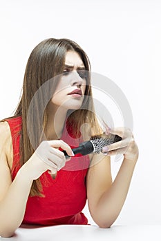 Women`s Hairloss Issues. Unpleased Caucasian Female Having Hair Problems. Checking Hair in Hairbrush.