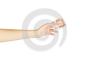 Women`s hand holds five thousand roubles on a white background.