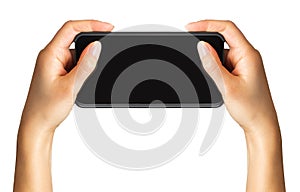 Women`s hand showing black smartphone, concept of taking photo or selfie