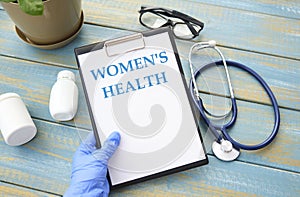 Women`s Health card with colorful background with defocused