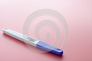 Women\'s health, fertility, planning maternity and pregnancy concept. A white plastic pregnancy test is isolated