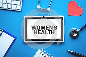 Women`s Health text on tablet screen. Medical concept