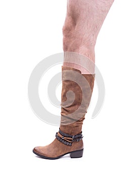 Women`s high leather boot with a hairy man`s leg