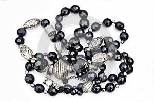 Women\'s jewelry with beads of black stones and silver beads