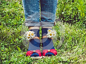 Women`s legs, fashionable shoes and bright socks