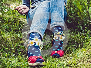 Women`s legs, fashionable shoes and bright socks