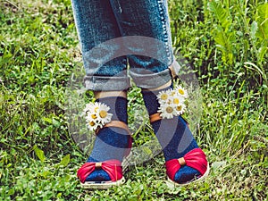 Women`s legs, fashionable shoes and bright socks