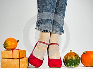 Women`s legs, fashionable shoes and colorful socks