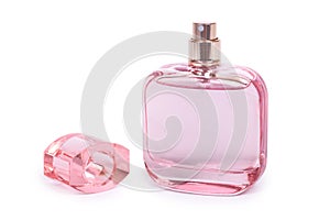 Women`s perfume in beautiful pink bottle isolated on white background, luxury smell, crystall glass