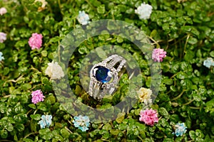 Women's platinum ring with a diamonds and blue precious sapphire jemstone photo