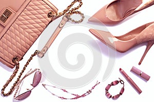 Women`s set of fashion accessories in pink color on white background