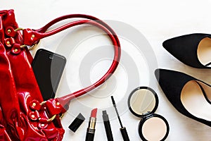 Women's set of fashion accessories on wooden background