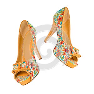 Women's shoes in floral print in the air