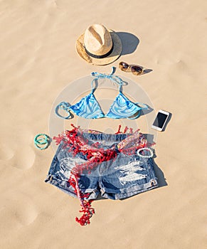 Women`s summer outfit in sand