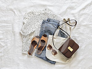 Women's summer spring clothes - blue mom jeans, muslin blouse, sandals, canvas shopper and cross body bag