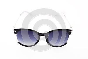 Women`s sunglasses with purple tint stand frontally isolated on a white background