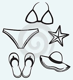 Womens swimsuit, hat, flip-flops and starfish