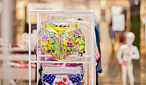 Women`s swimsuits for sale at a seaside shop. Advertise, Sale, Fashion concept