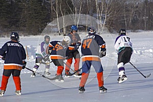 Women`s teams compete in a Pond Hockey Festival in Rangeley.