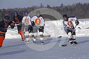 Women`s teams compete in a Pond Hockey Festival in Rangeley.