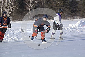 Women`s teams compete in a Pond Hockey Festival in Rangeley.