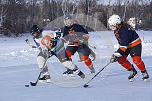 Women`s teams compete in a Pond Hockey Festival in Rangeley.