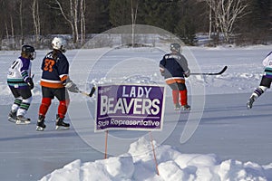 Women`s teams compete in a Pond Hockey Festival in Rangeley.