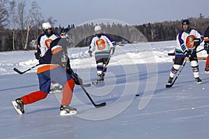 Women`s teams compete in a Pond Hockey Festival in Rangeley.