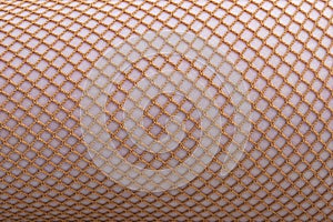Women`s tights, stockings, Brown mesh tights. Close-up. Abstract background made of nylon mesh