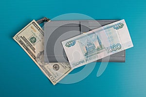 Women`s wallet with banknotes. Ruble bills. Dollar bills.