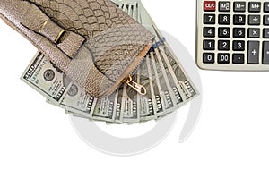 Women`s wallet, dollars, calculator isolated on a white background. Close-up. View from above.