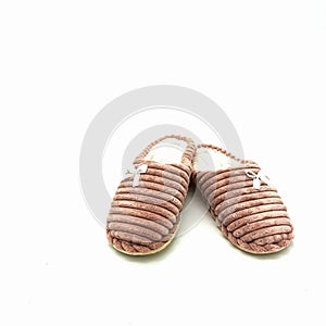 Women`s warm home slippers. Made of pink embossed plush