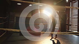 Women self defense girl power. African american woman fighter training punches on boxing ring. Healthy strong girl