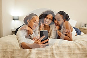 Women, selfie and friends in a home with profile picture, social media and smile at sleepover. Mobile, bonding and