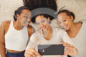 Women, selfie and friends smile in a home with profile picture, social media and happy at sleepover. House, bonding and