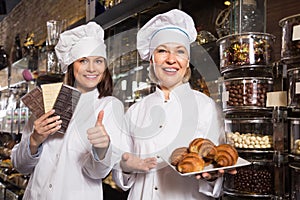 Women selling chocolates and sweet pastry