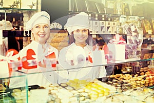 Women selling fine sweet pastry